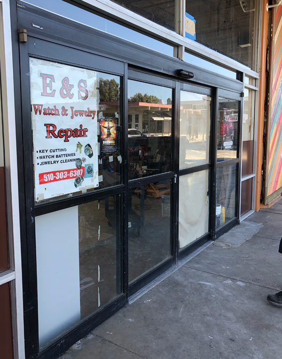 automatic door installation with black framing in Fremont