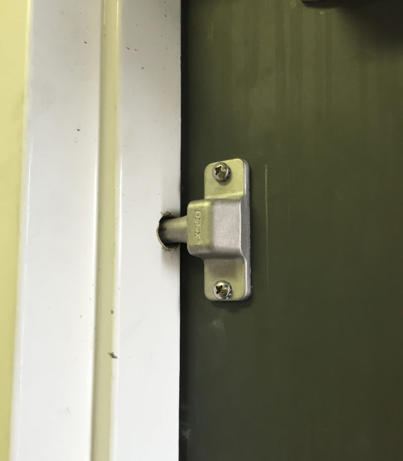 commercial locksmith services repairing a deadbolt door