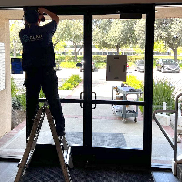 One of our pros is repairing a commercial door