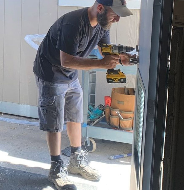one of our experts is working on a commercial door